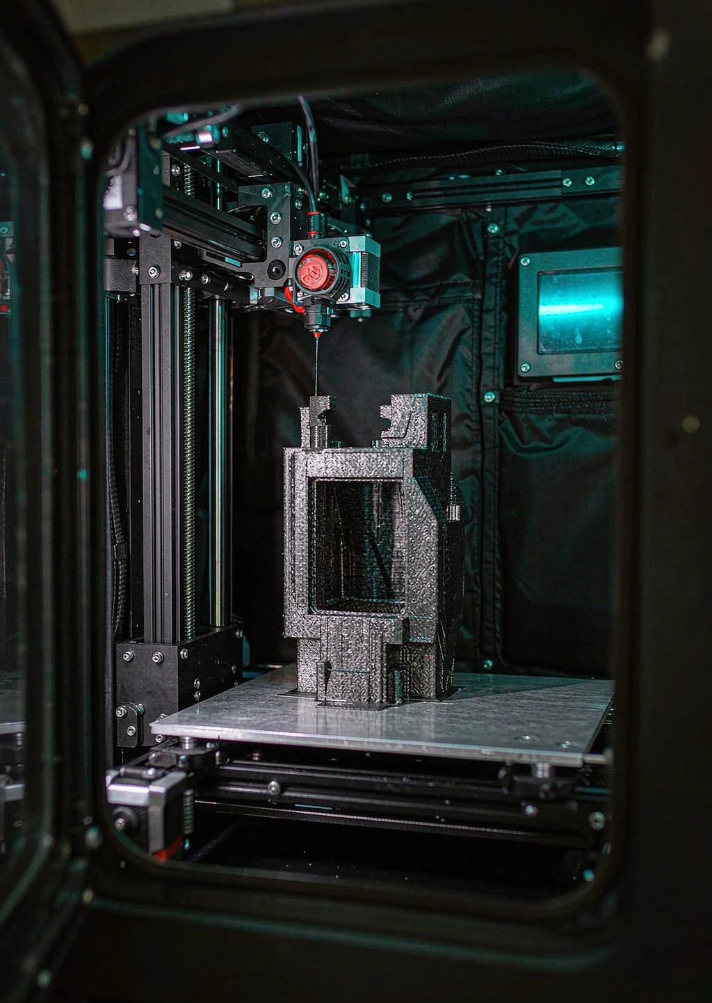 Industrial FDM printer producing a prototype part