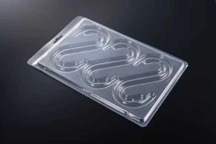 Clear plastic blister pack with molded candy cane shapes