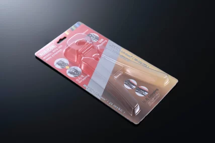 wire stripper in clear blister packaging on a dark background.