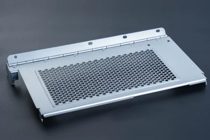 Silver metal panel with hexagonal mesh grille and hinge