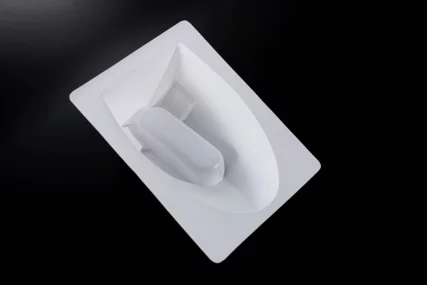 White plastic molded tray with a raised handle